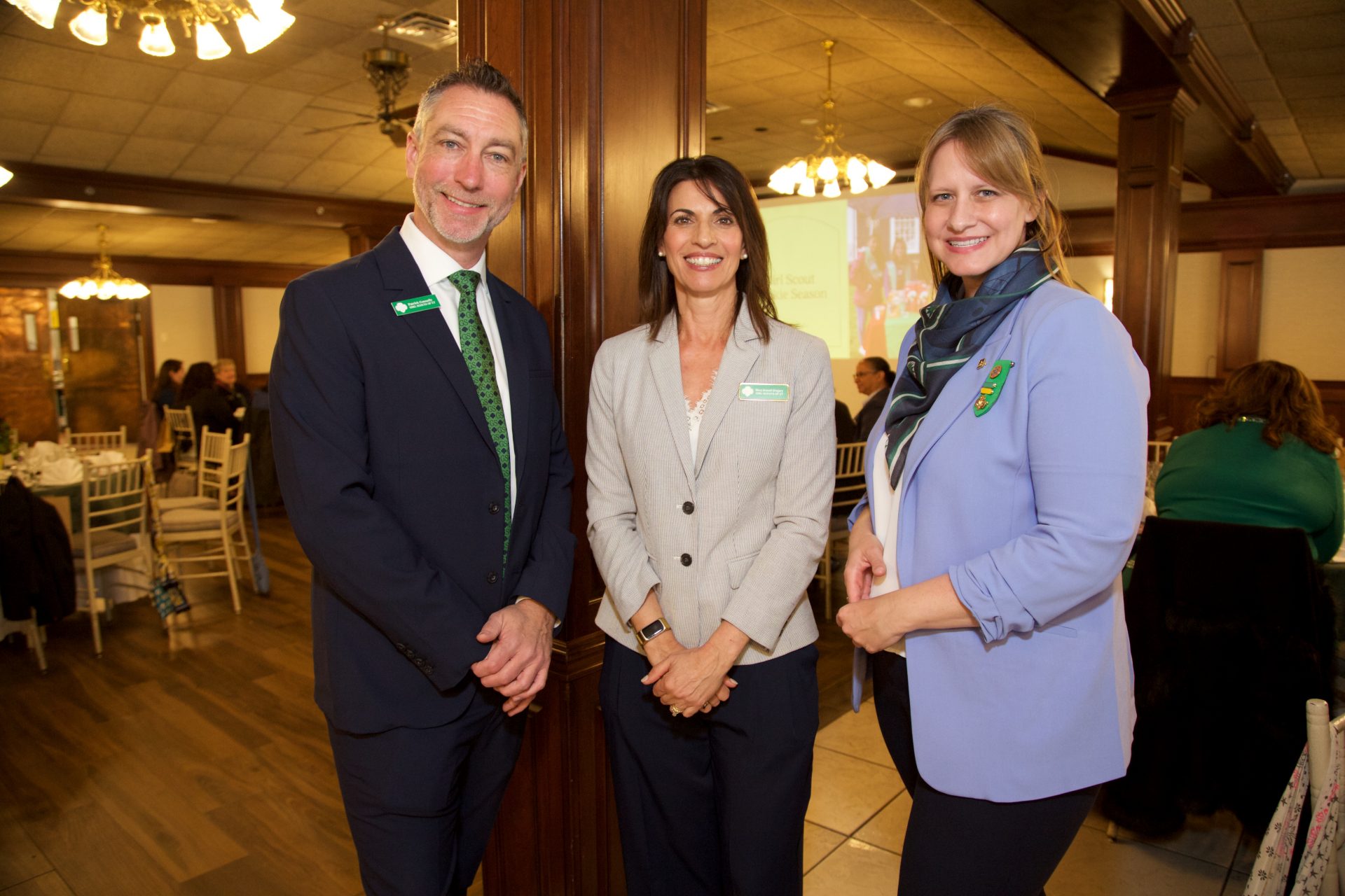 Three executies from Girl Scouts of Connecticut, standing together and smiling
